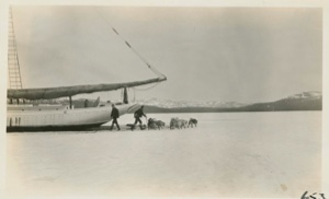 Image of Himoe, Bert and dogs astern of Bowdoin on ice